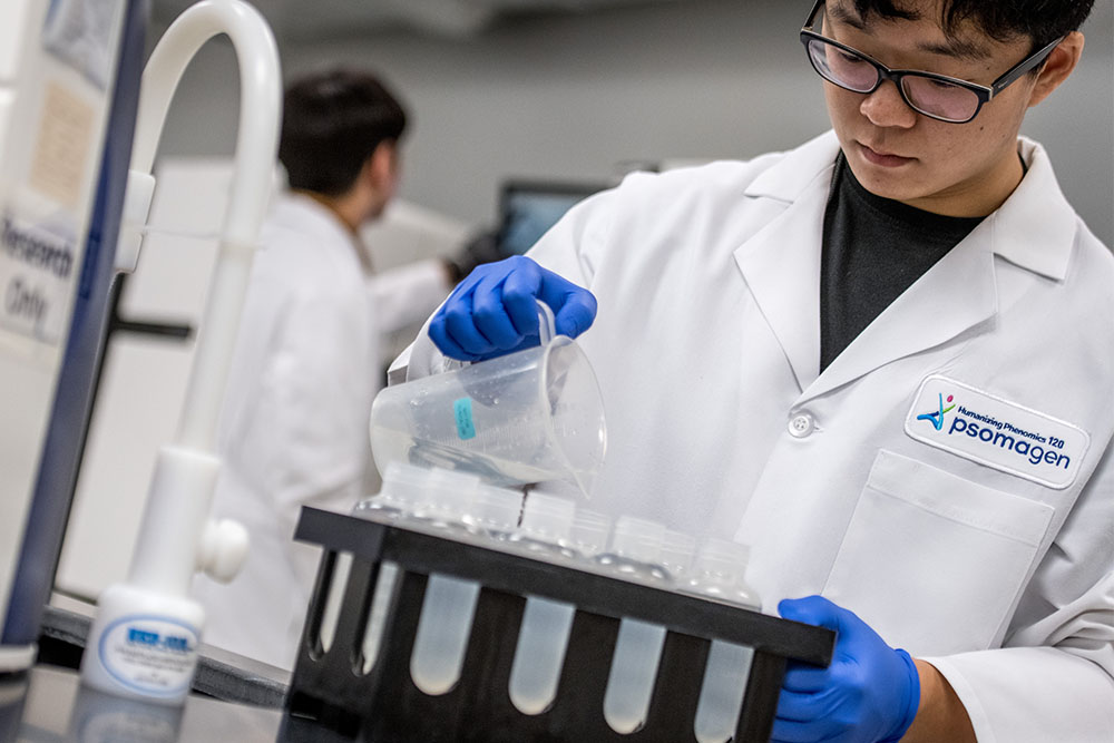 Scientist pouring solution into NGS cartridge