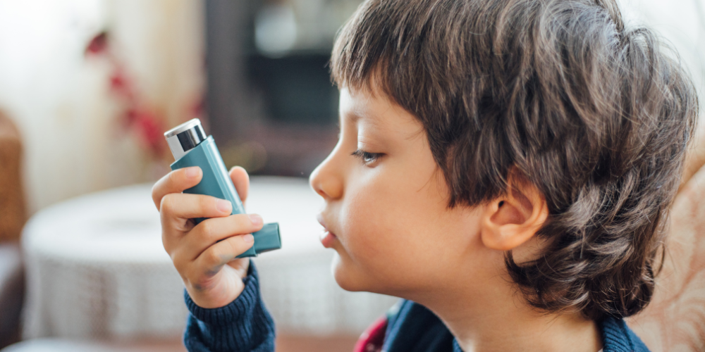 child with asthma inhaler